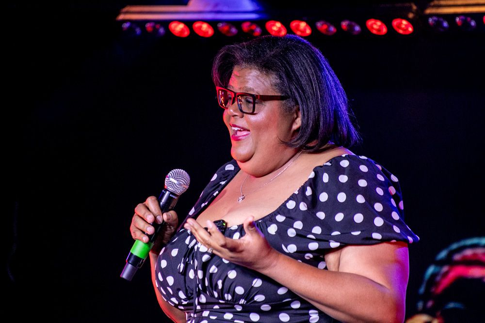 Comedian in a polka dot dress