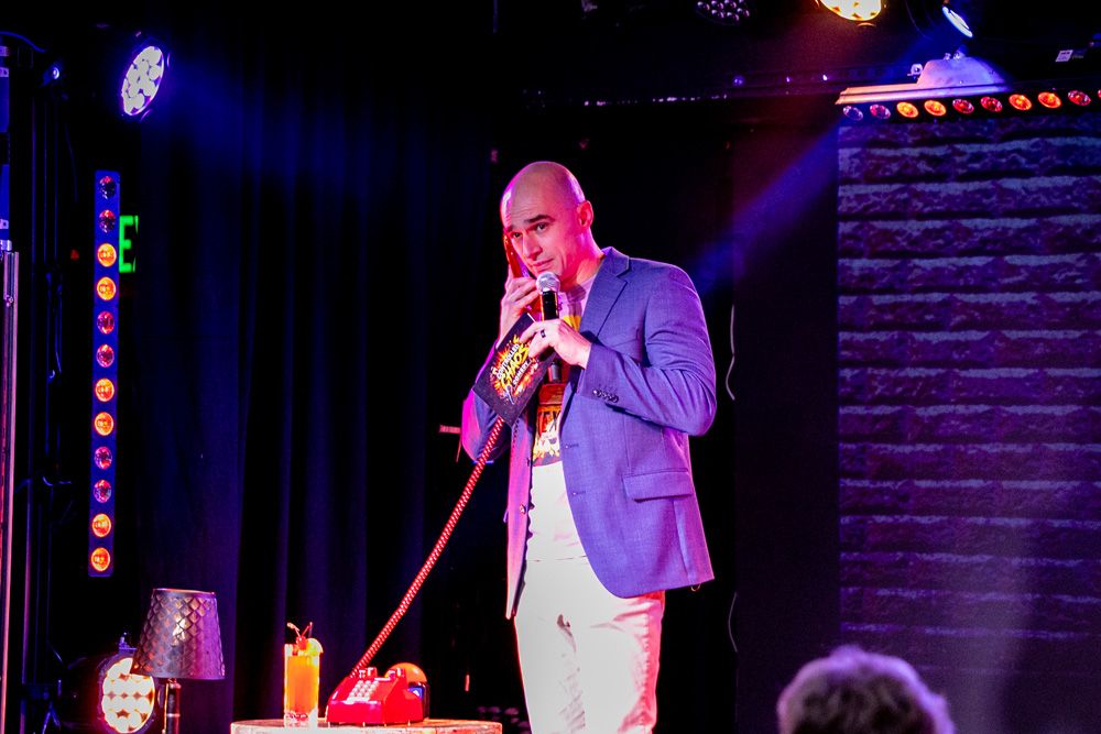 Host taking a call on the red phone